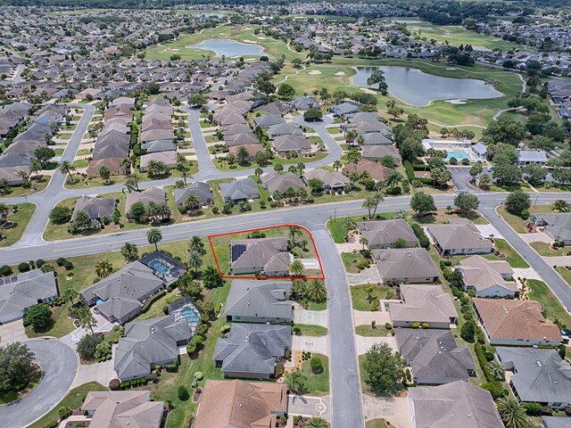 bird's eye view with a water view and a residential view