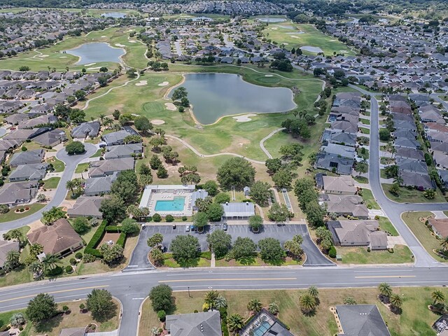 bird's eye view with a residential view, view of golf course, and a water view