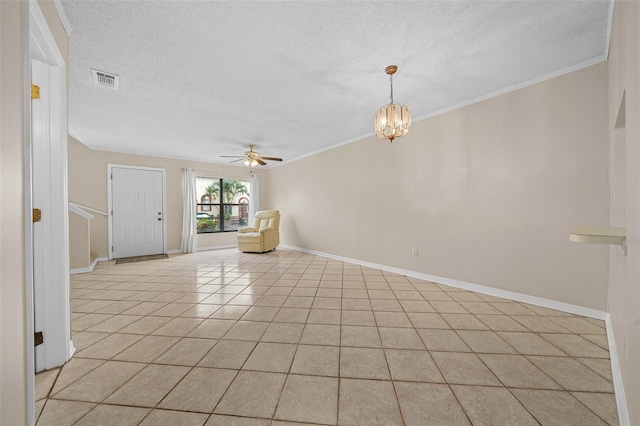 unfurnished living room featuring ornamental molding, a textured ceiling, ceiling fan with notable chandelier, and light tile patterned floors