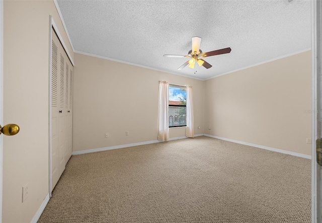 unfurnished bedroom with a closet, carpet floors, and ceiling fan