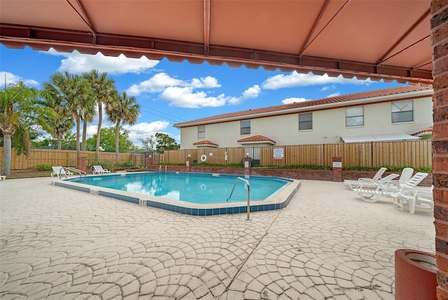 view of swimming pool featuring a patio area