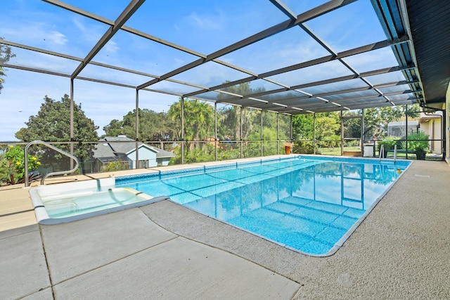 view of pool featuring glass enclosure and a patio