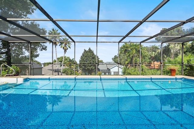 view of pool with a lanai