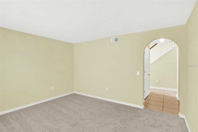 spare room with light carpet