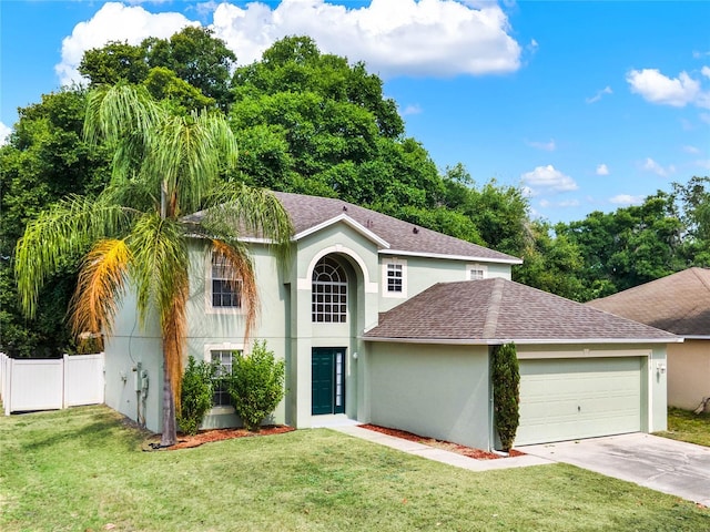 view of front of home featuring a front lawn and a garage