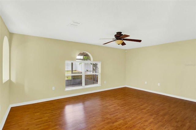 unfurnished room with hardwood / wood-style flooring and ceiling fan