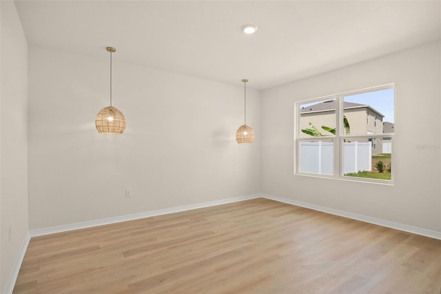 unfurnished room with light hardwood / wood-style flooring