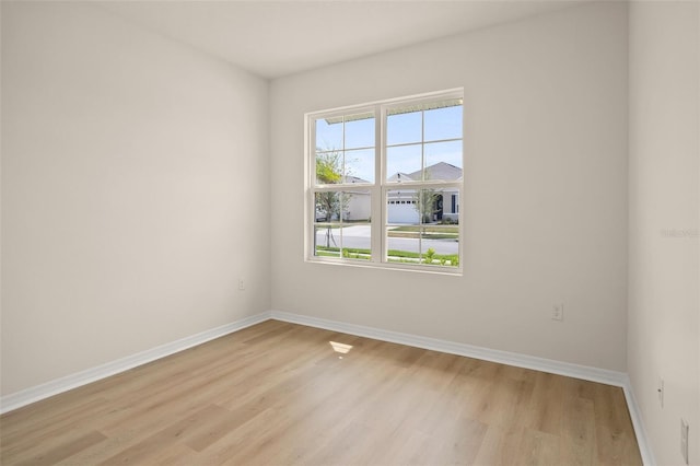 spare room featuring light hardwood / wood-style floors