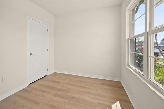 unfurnished room featuring light wood-type flooring