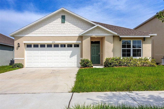 view of front facade featuring cooling unit, a front yard, and a garage