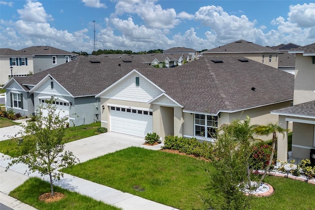 single story home featuring a front lawn and a garage