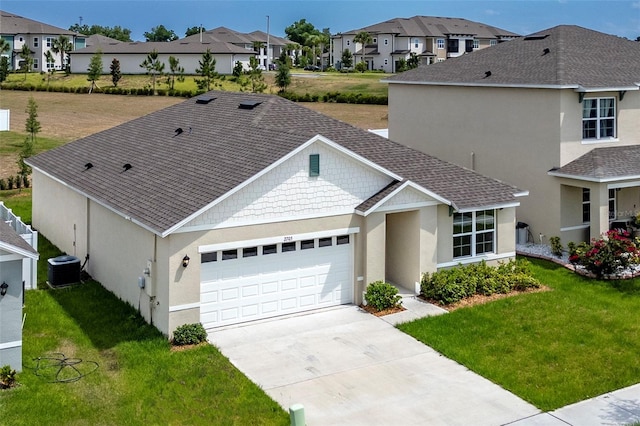 ranch-style home featuring a garage and a front lawn