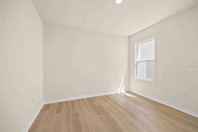 empty room with light wood-type flooring