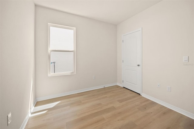 spare room with light wood-type flooring