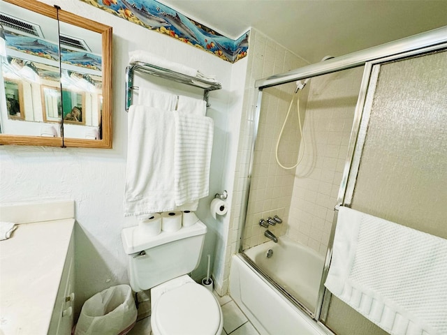 full bathroom featuring tile floors, shower / bath combination with glass door, toilet, and vanity