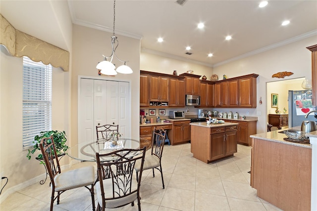 kitchen featuring pendant lighting, sink, light tile patterned floors, a center island, and crown molding