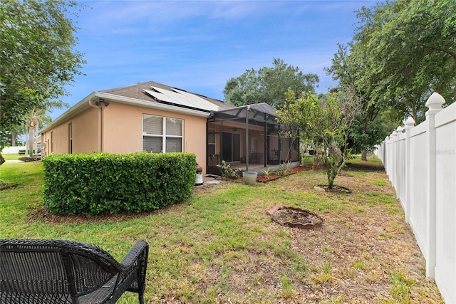 view of yard featuring a lanai