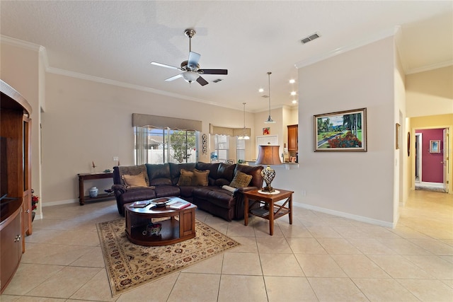 living room with a textured ceiling, crown molding, light tile patterned flooring, and ceiling fan