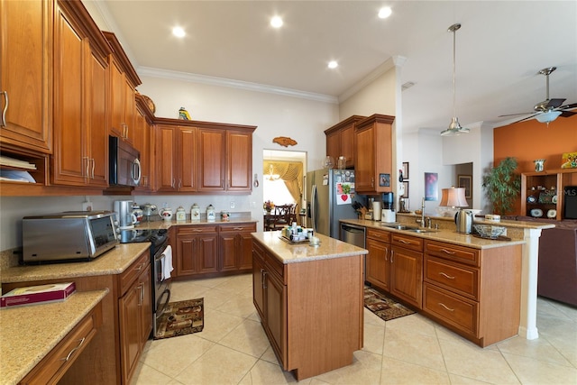 kitchen featuring pendant lighting, a kitchen island, stainless steel appliances, ornamental molding, and ceiling fan