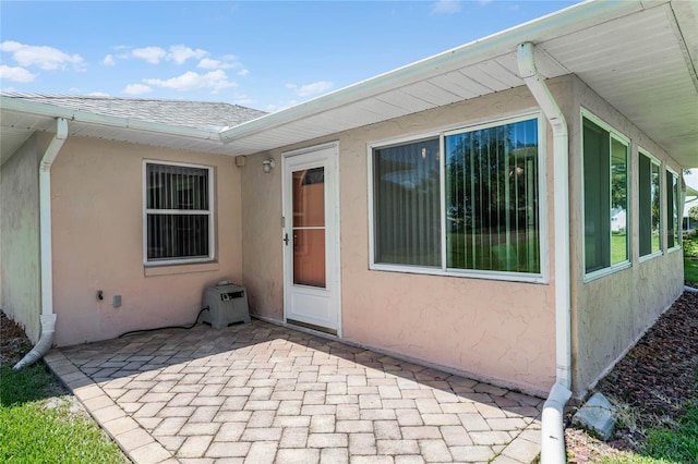 entrance to property featuring a patio area