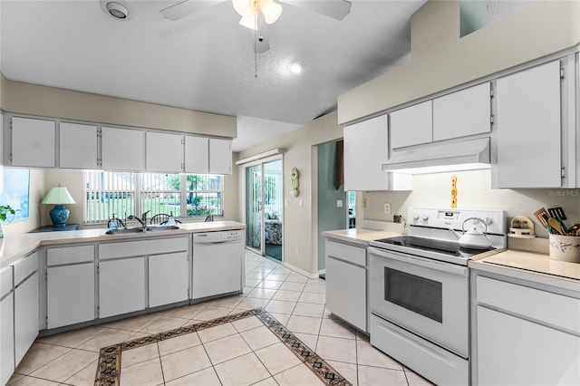 kitchen featuring ceiling fan, white cabinetry, custom range hood, and white appliances