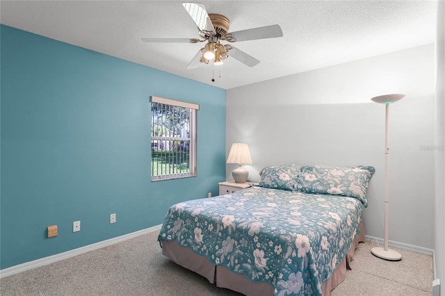 bedroom featuring ceiling fan and carpet floors