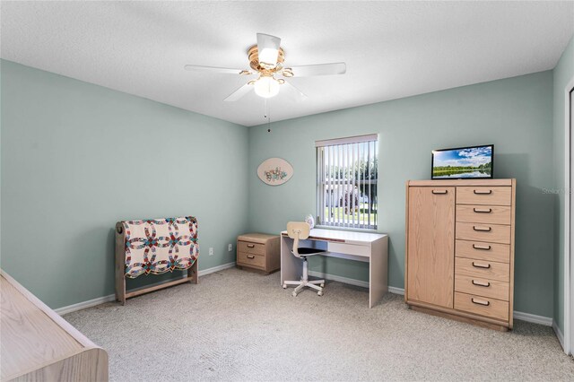 office with ceiling fan and light colored carpet