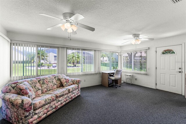 sunroom / solarium featuring ceiling fan and a healthy amount of sunlight