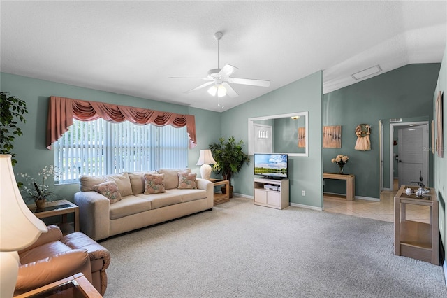 carpeted living room with ceiling fan and lofted ceiling