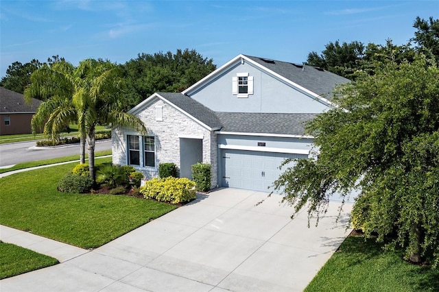 front facade featuring a garage and a front lawn