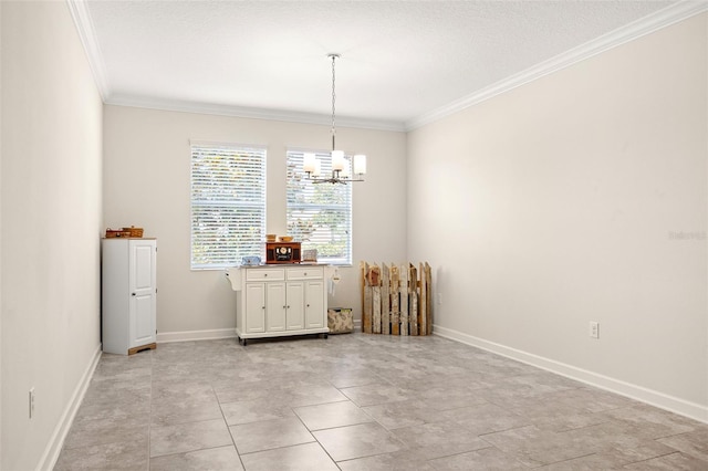 tiled spare room featuring ornamental molding and an inviting chandelier