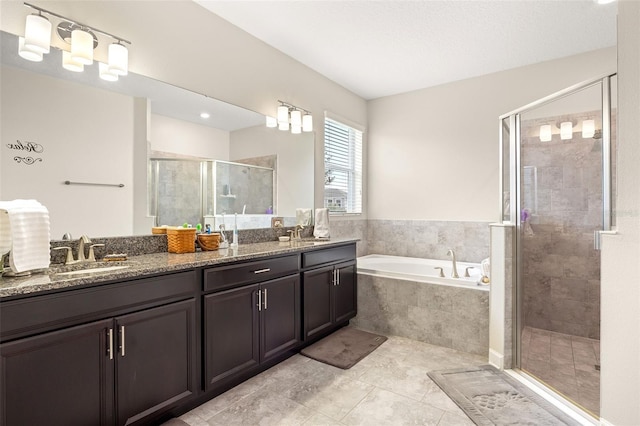 bathroom featuring dual vanity, tile floors, and plus walk in shower