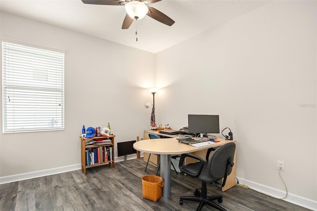 office area with a wealth of natural light, dark hardwood / wood-style floors, and ceiling fan