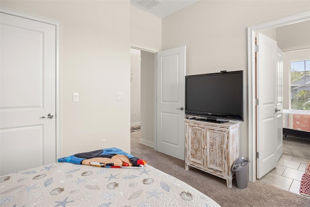 bedroom with light tile floors