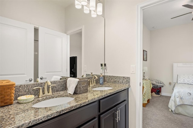 bathroom with ceiling fan and double sink vanity