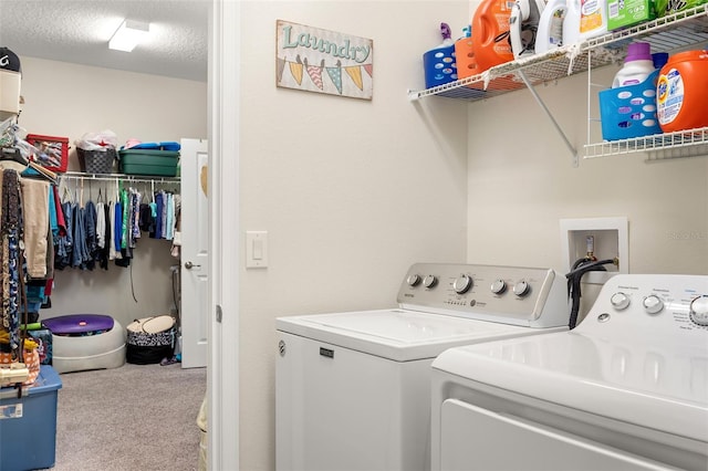 washroom featuring washer hookup, a textured ceiling, light colored carpet, and independent washer and dryer