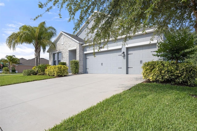 view of front of house featuring a garage and a front yard