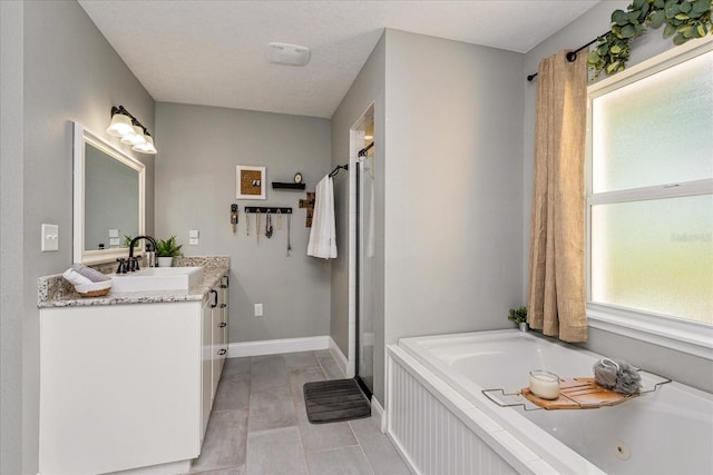 bathroom with vanity, tile patterned flooring, and shower with separate bathtub