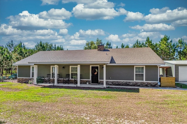 view of front facade with a patio area and a front lawn