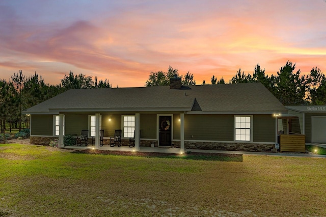 view of front facade featuring a yard and a patio area