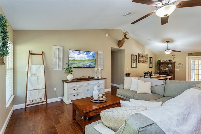 living room featuring lofted ceiling and dark hardwood / wood-style floors