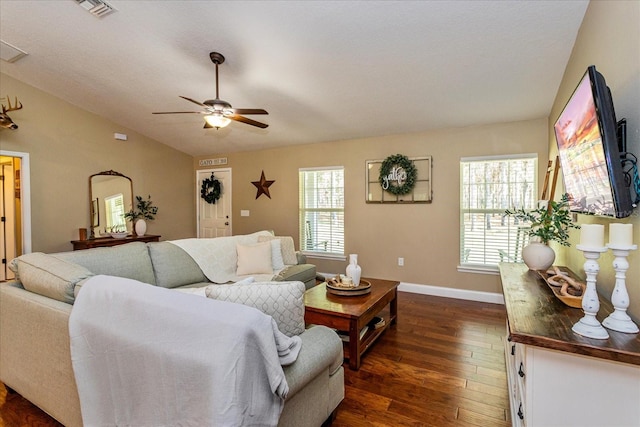 living room with lofted ceiling, dark hardwood / wood-style flooring, and ceiling fan