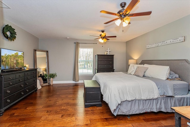 bedroom featuring ceiling fan and dark hardwood / wood-style flooring