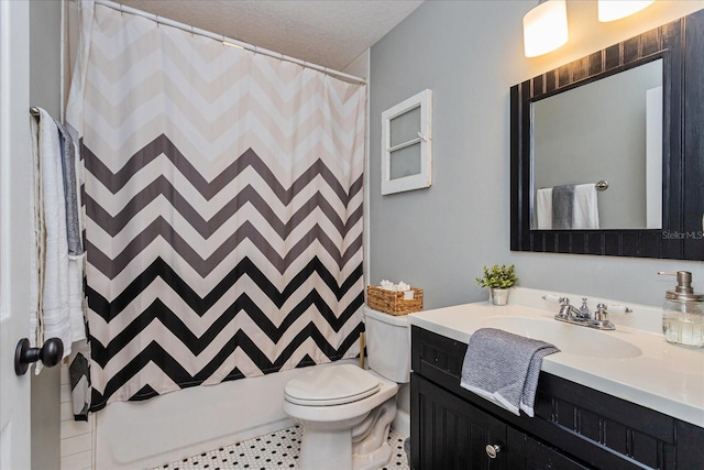 full bathroom featuring vanity, shower / tub combo, toilet, tile patterned floors, and a textured ceiling