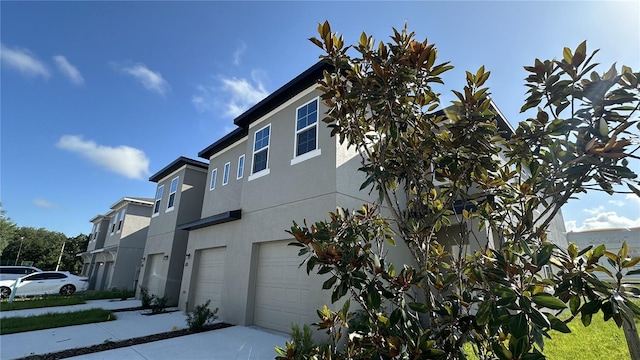 view of side of home with a garage