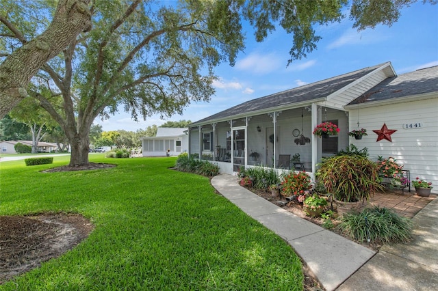 view of yard with a sunroom