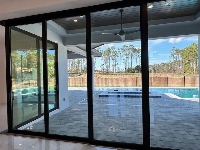 doorway to outside featuring ceiling fan