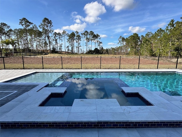 view of pool with an in ground hot tub