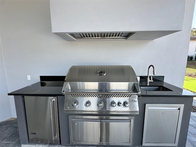 view of patio / terrace with area for grilling, exterior kitchen, and sink