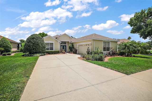 view of front of house featuring a garage and a front lawn